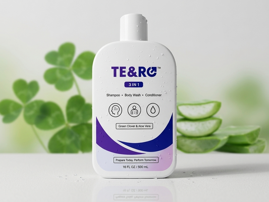 A 16 fl oz bottle of TE&RO 3 in 1 Shampoo, Body Wash, and Conditioner. The white bottle features purple and blue branding and is set against a soft-focus background of green clover and aloe vera slices.